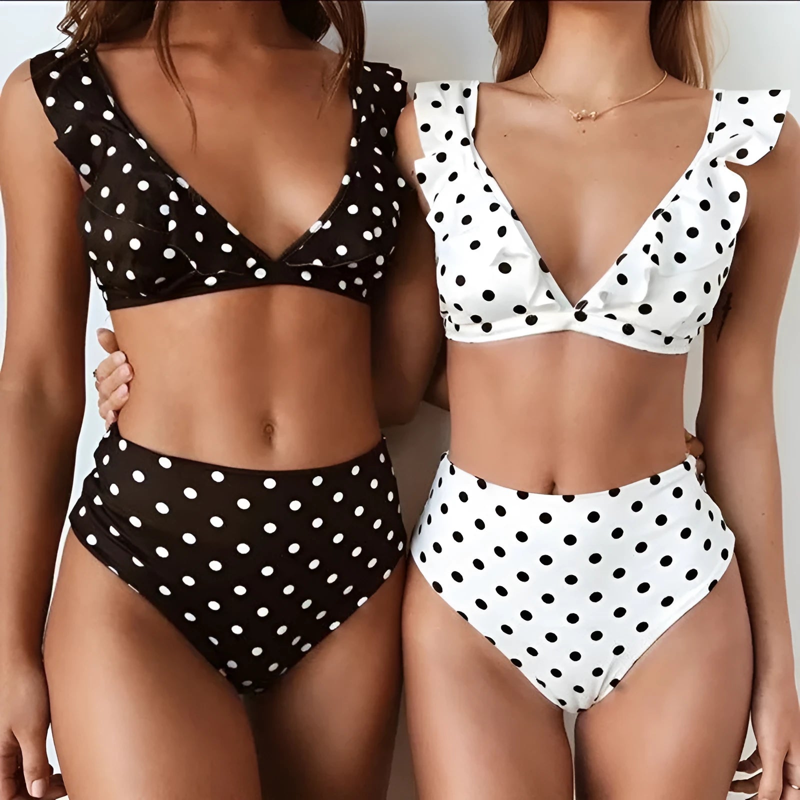 Black and white polka dot ruffled deep V-neck bikini set with nylon fabric, including top and shorts.