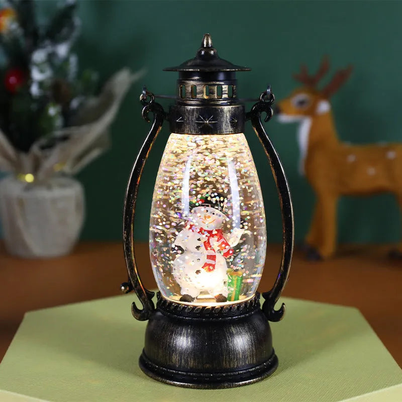 Plastic Christmas desktop oil lamp decoration with a glowing crystal ball and snowman figure.