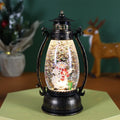 Plastic Christmas desktop oil lamp decoration with a glowing crystal ball and snowman figure.