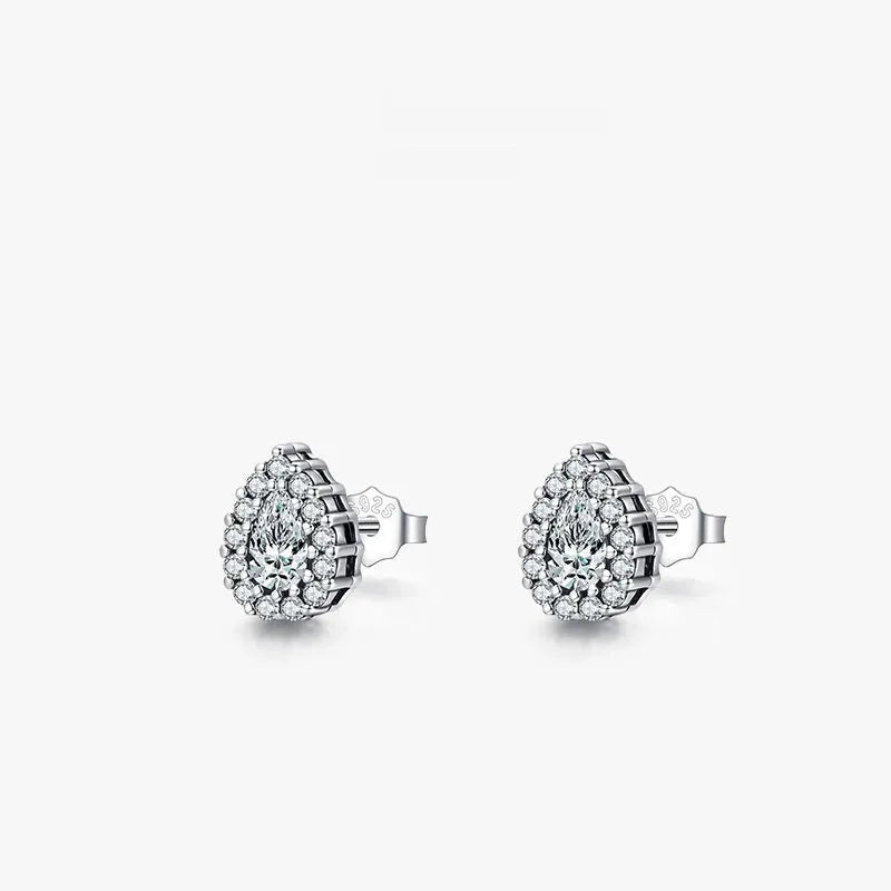 Close-up of a pair of polished silver water drop shaped ear studs on a 925 sterling silver post.