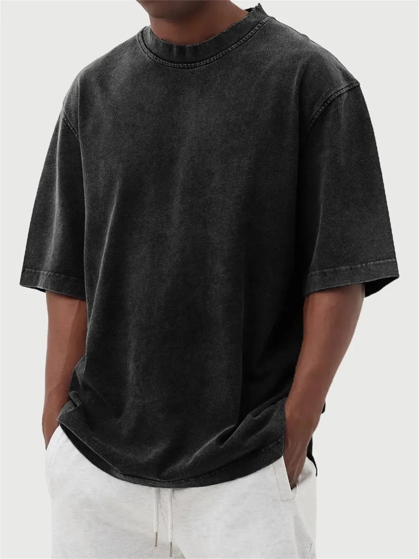Men's loose fit distressed pullover t-shirt in stone washed polyester showing half sleeve design
