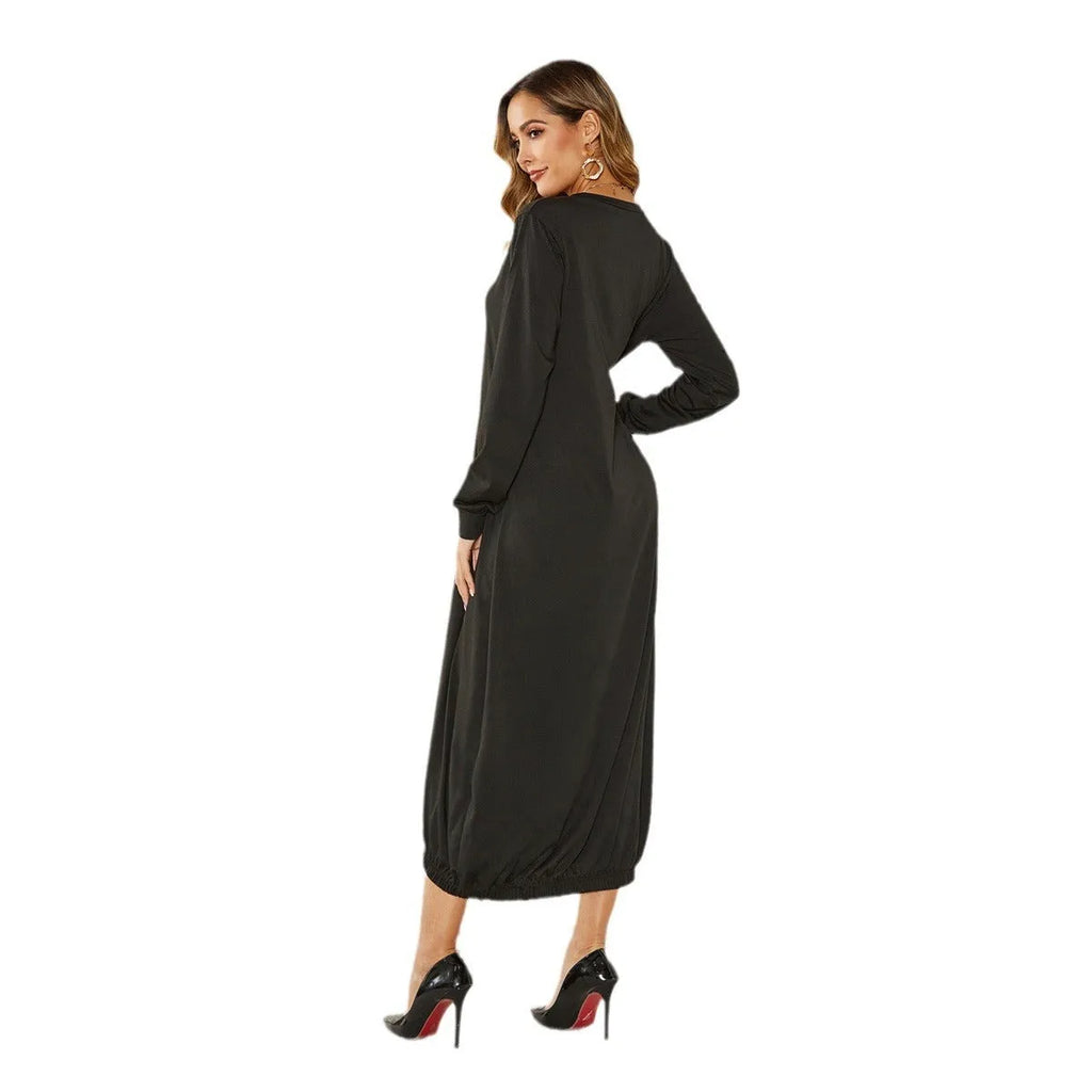 Loose black lantern dress with a lace-up crew neck, showcasing a relaxed silhouette.