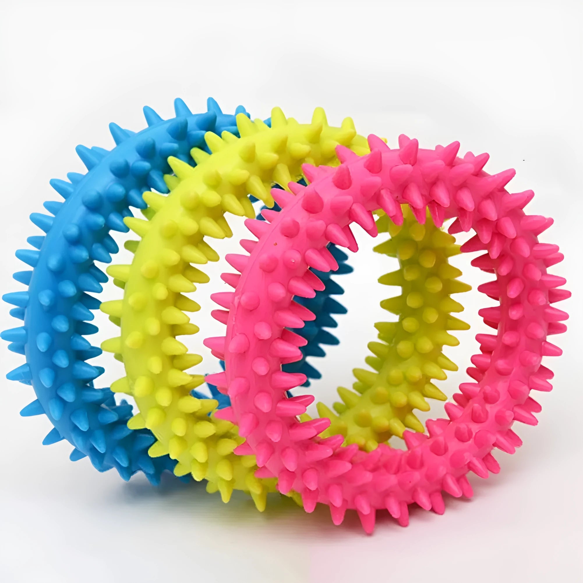 TPR spiky circle ring dog chew toy in assorted colours showing dental cleaning nubs