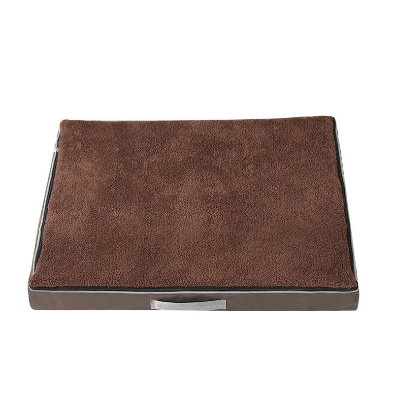 Removable washable sponge dog mat in brown, available in multiple sizes on a wooden floor.