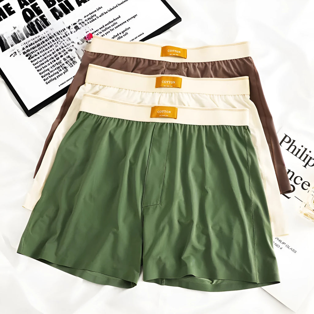 Pack of three pairs of men's solid colour ice silk underwear in loose fit.