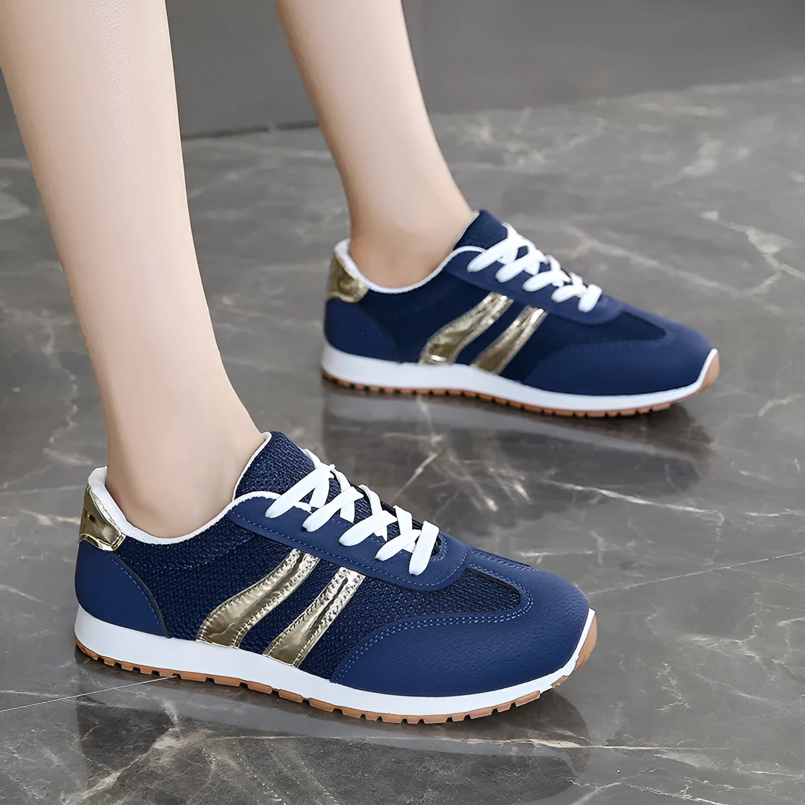 Blue women's casual sports shoes with lace-up front, cross shoulder straps, and a flat non-slip rubber sole.