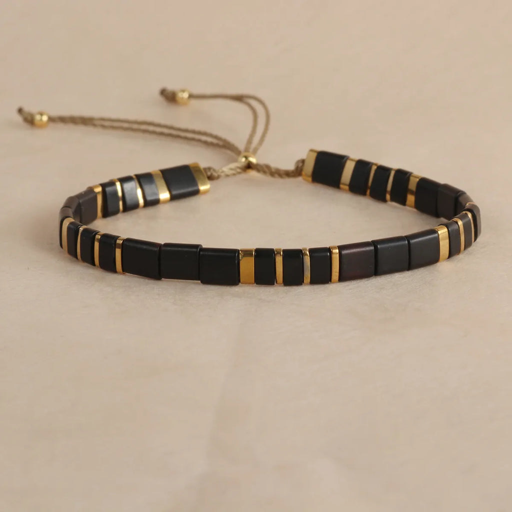 Geometric glass pull bead bracelet in five colour options on wrist
