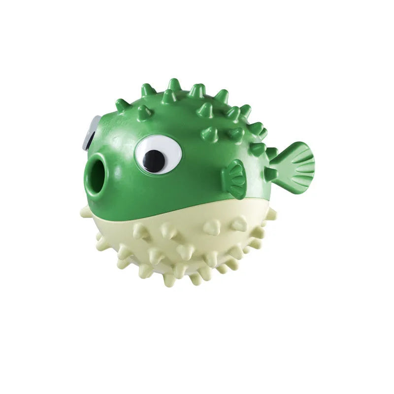 Green fish-shaped dog chew toy with treat dispensing hole and textured surface