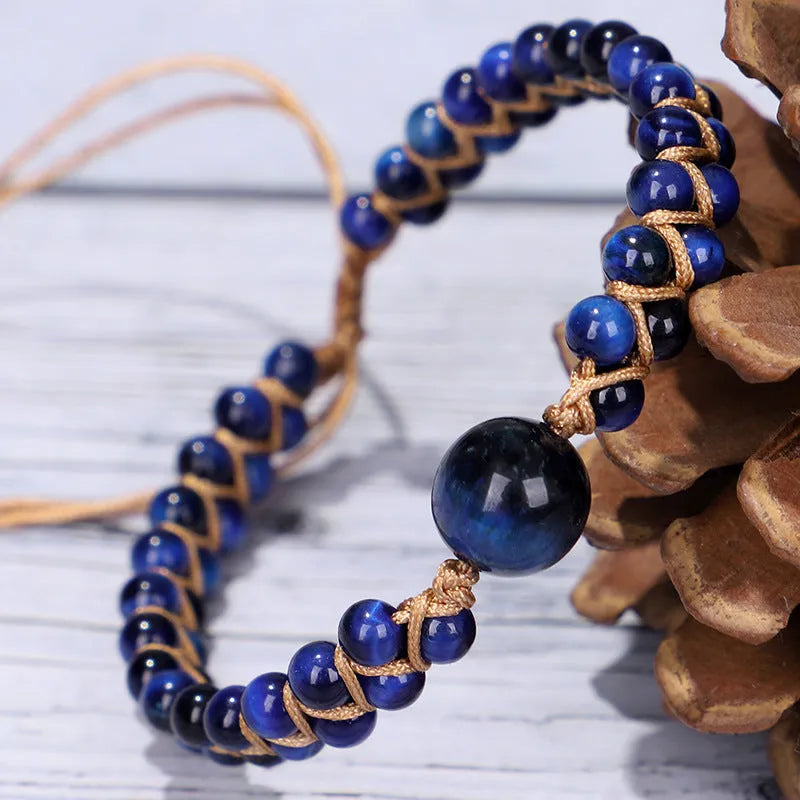 Handmade woven bracelet with geometric pattern in blue tigereye or amethyst stone beads
