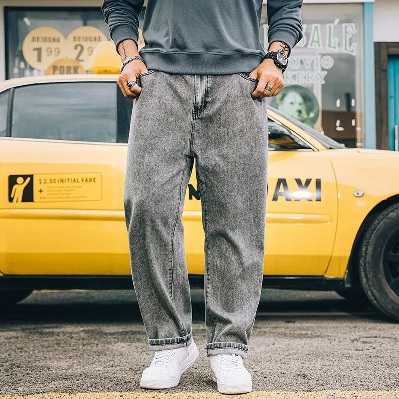 Men's loose straight cotton jeans in dark blue, light blue, and gray with mid-waist zipper fly