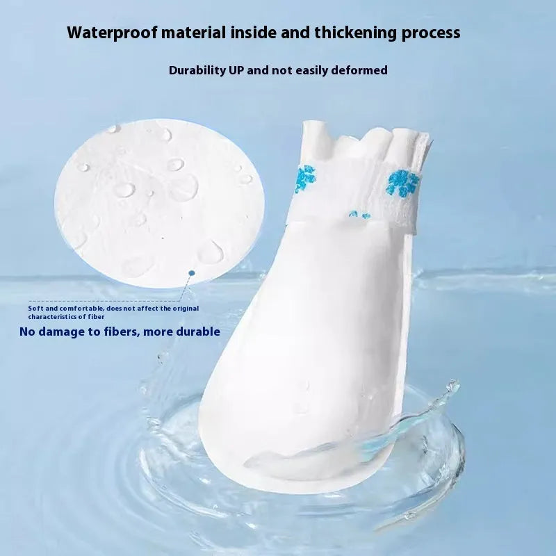 White disposable waterproof pet shoe covers for dogs in S and M sizes