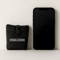 Black inflatable cushion made from 40D nylon TPU showing compact size for outdoor seating