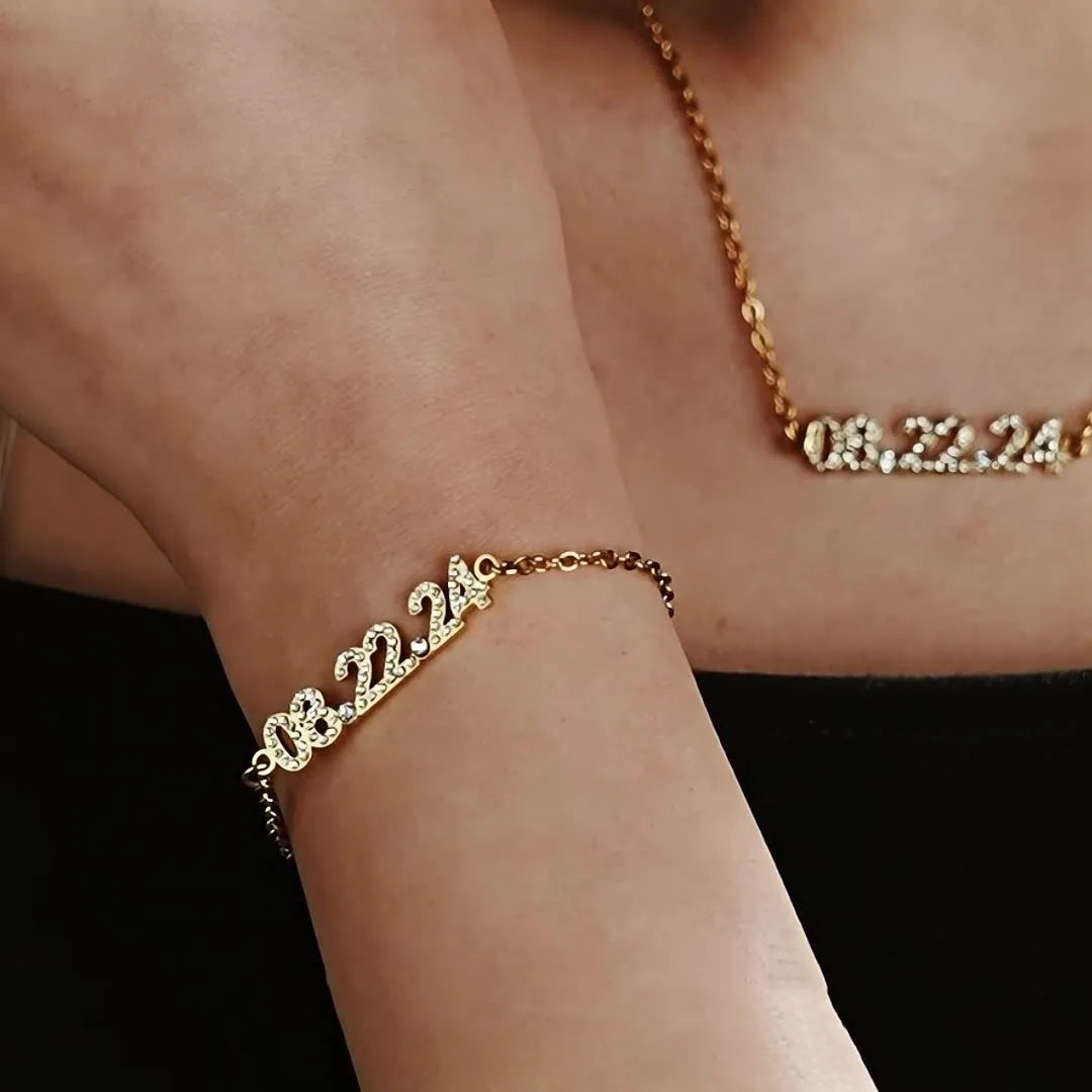 Stainless steel digital bracelet with diamond-set numbers in gold, rose gold, or steel colour.
