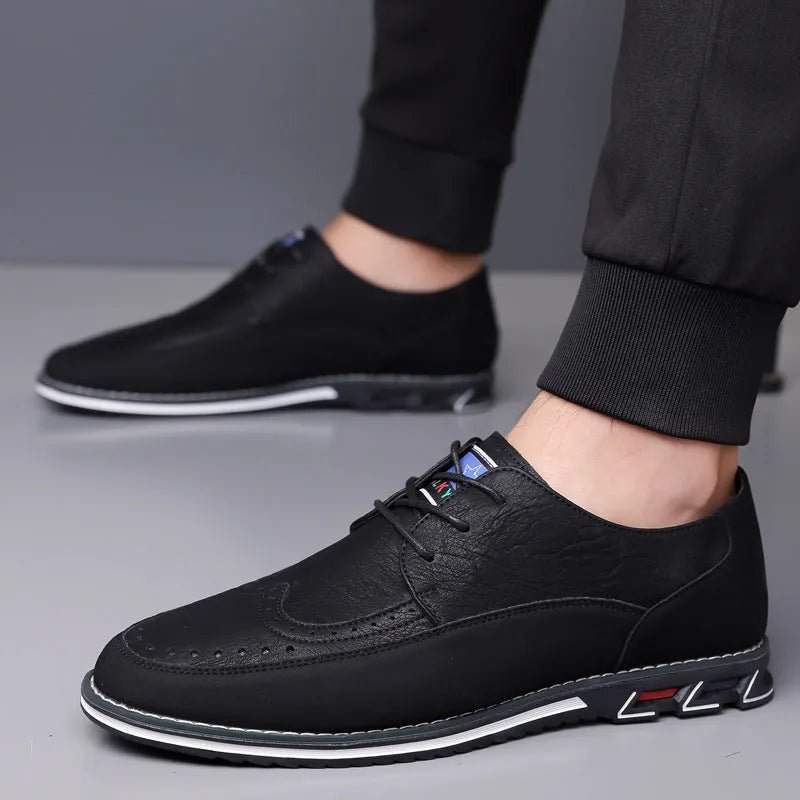 Men's black leather toe cap casual shoes with a fabric upper and rubber sole on a white background.