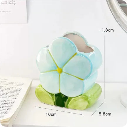 Ceramic flower pen holder storage box with floral pattern on desktop