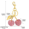 Zinc alloy three-dimensional cherry key ring pendant in red colour