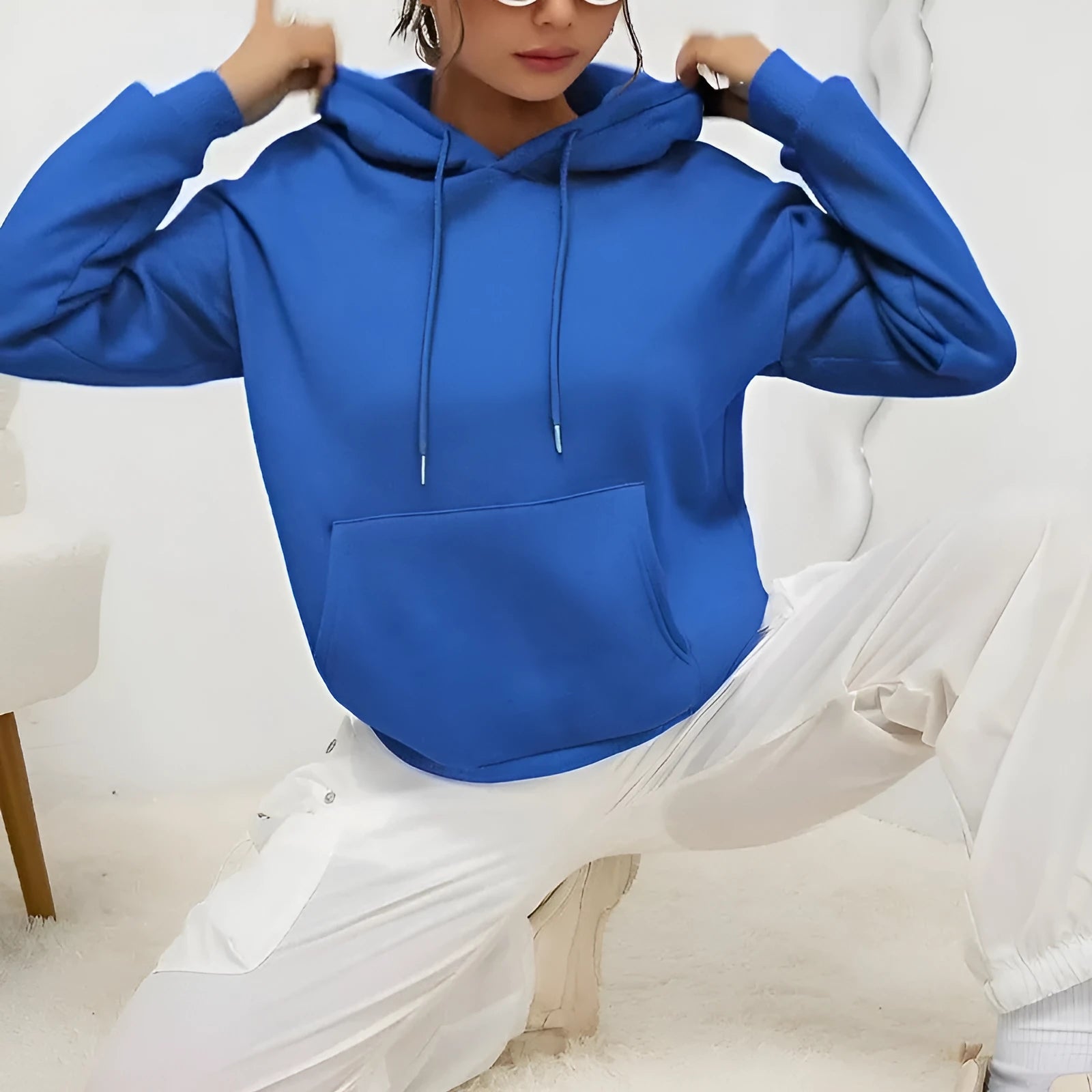 Women's loose fit grey sweatshirt with drawstring hood and kangaroo pocket