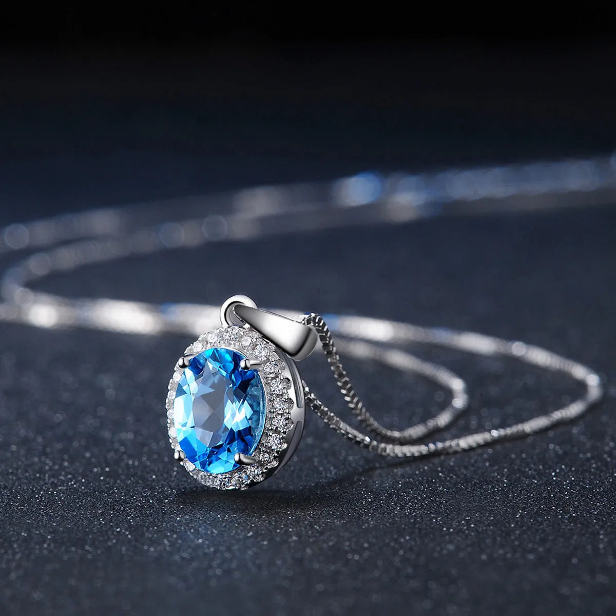 925 sterling silver jewellery set with blue topaz gems including earrings, ring, necklace and pendant