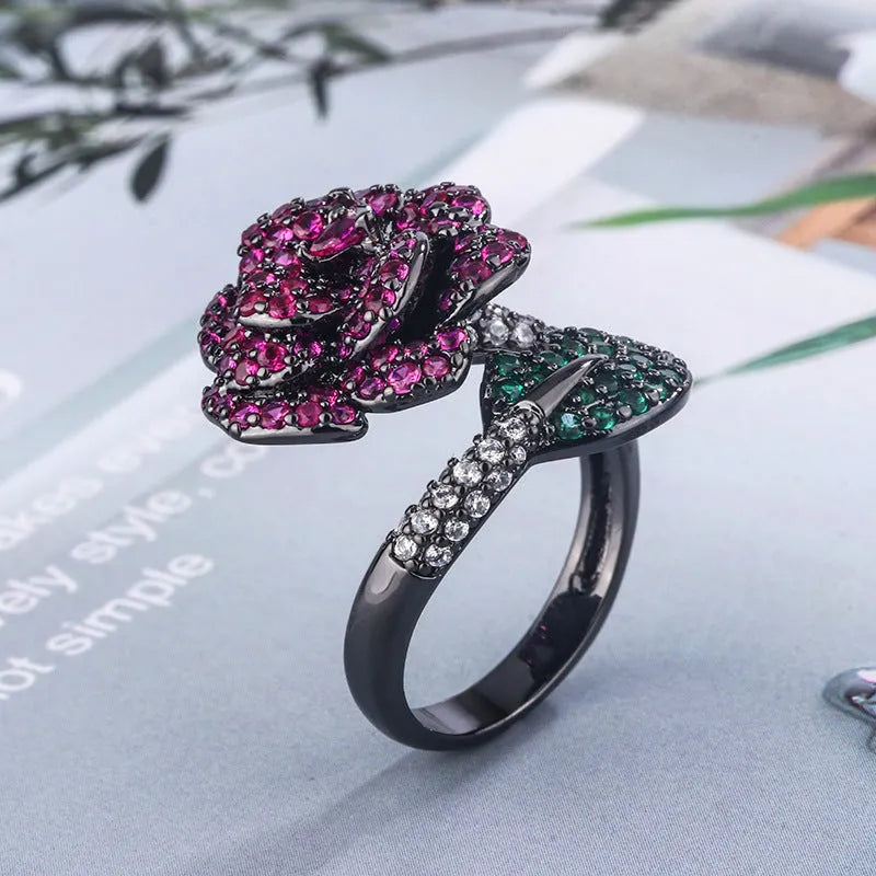 Geometric black gold women's ring with simulated red corundum stones