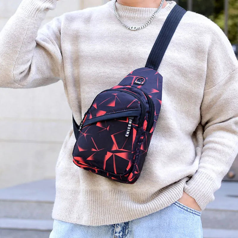 Blue print sling chest bag with a crossbody strap, showing the earphone hole and zipper opening.