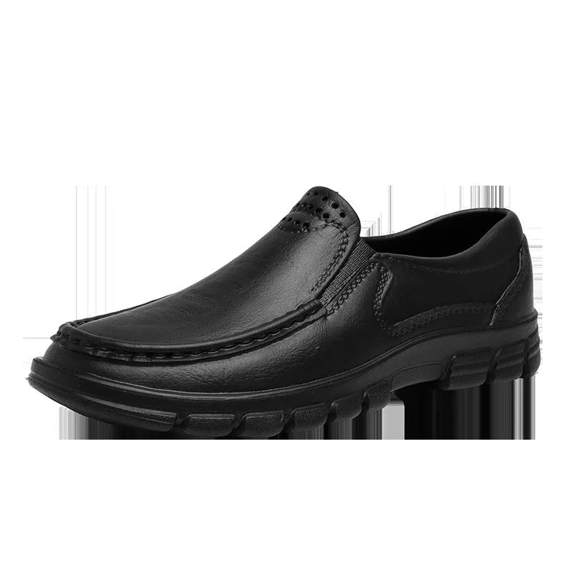Men's black slip-on platform shoes with round toe and mid-top design on a white background.
