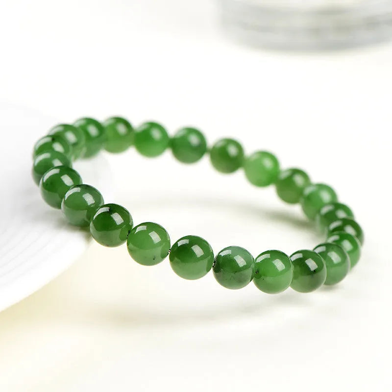 Natural jasper bead bracelet with polished spherical beads on a string, available in multiple sizes.