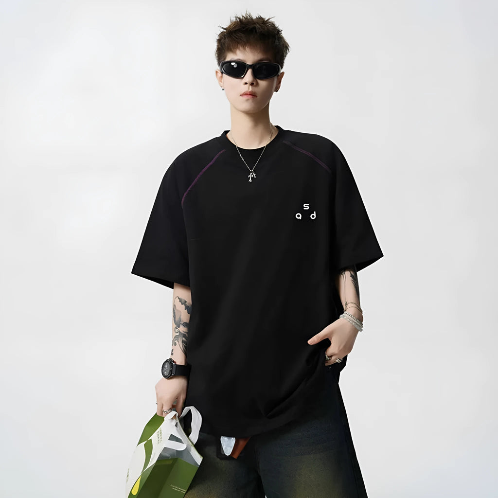 Men's loose fit black cotton t-shirt with a letter print on the front, short sleeves, and a round neck.