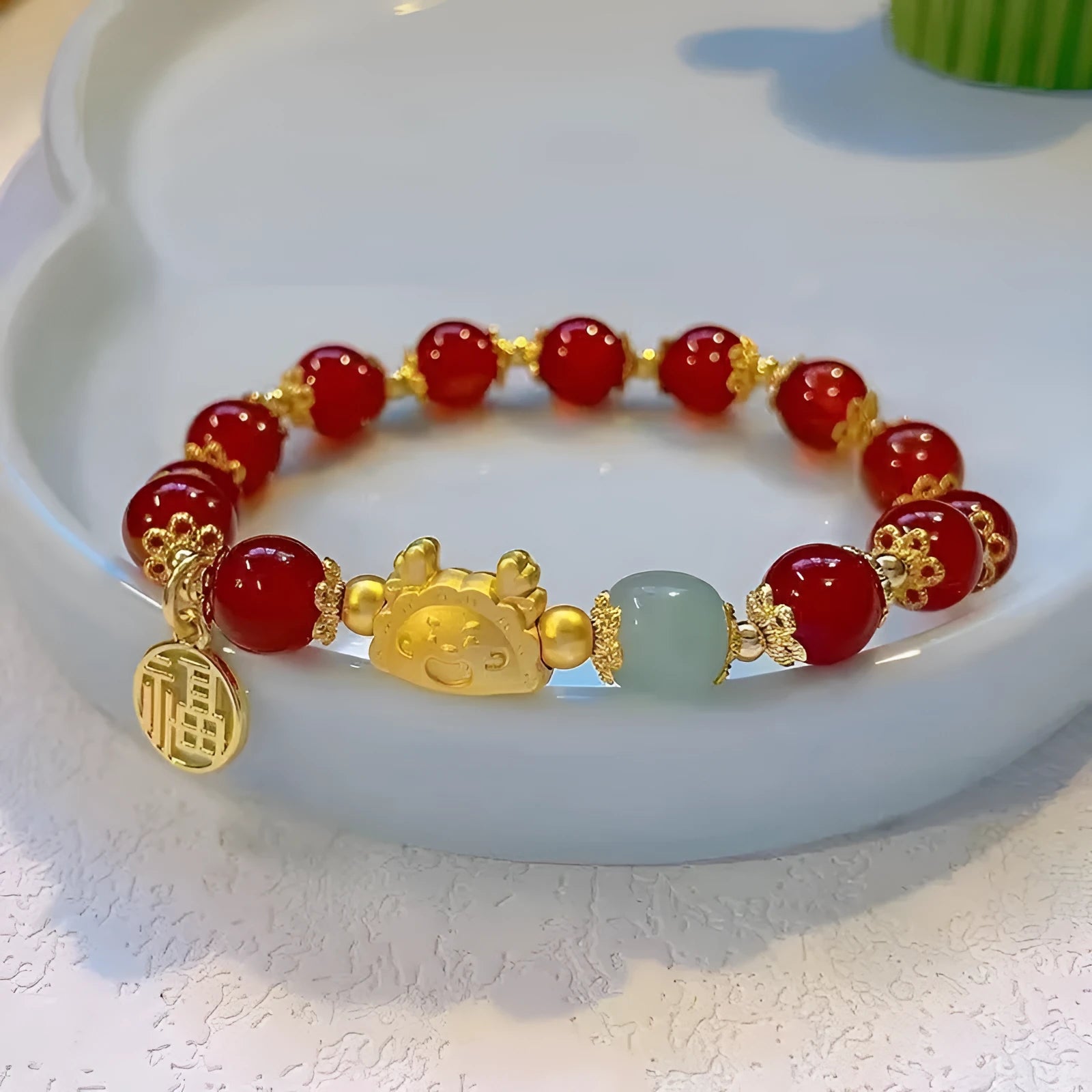 Niche Girlfriends Ice Crack Floral glazed bracelet with red, pink, and white glass beads and a zodiac charm.