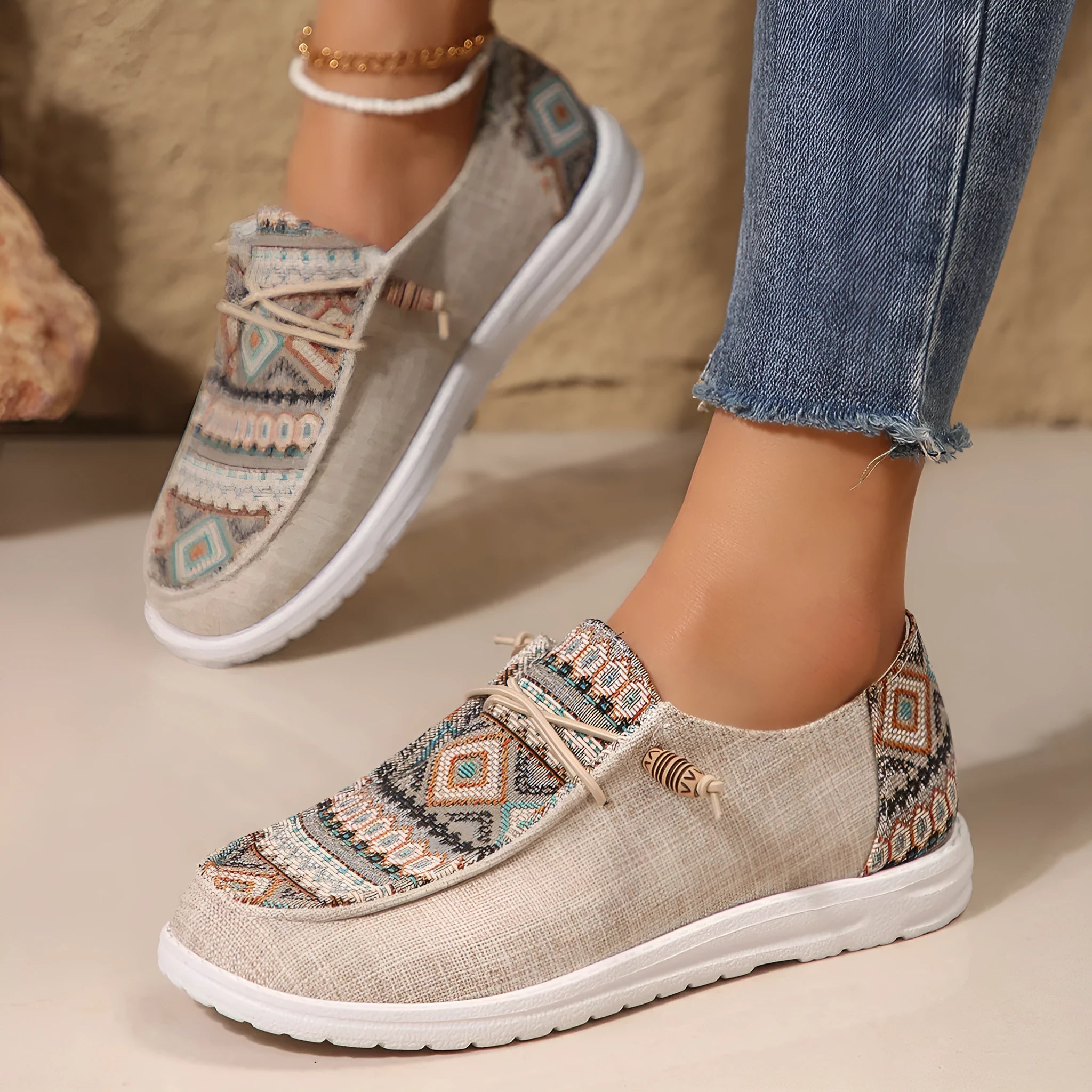 Women's black slip-on flat shoes with round toe and low-top profile on a neutral background.