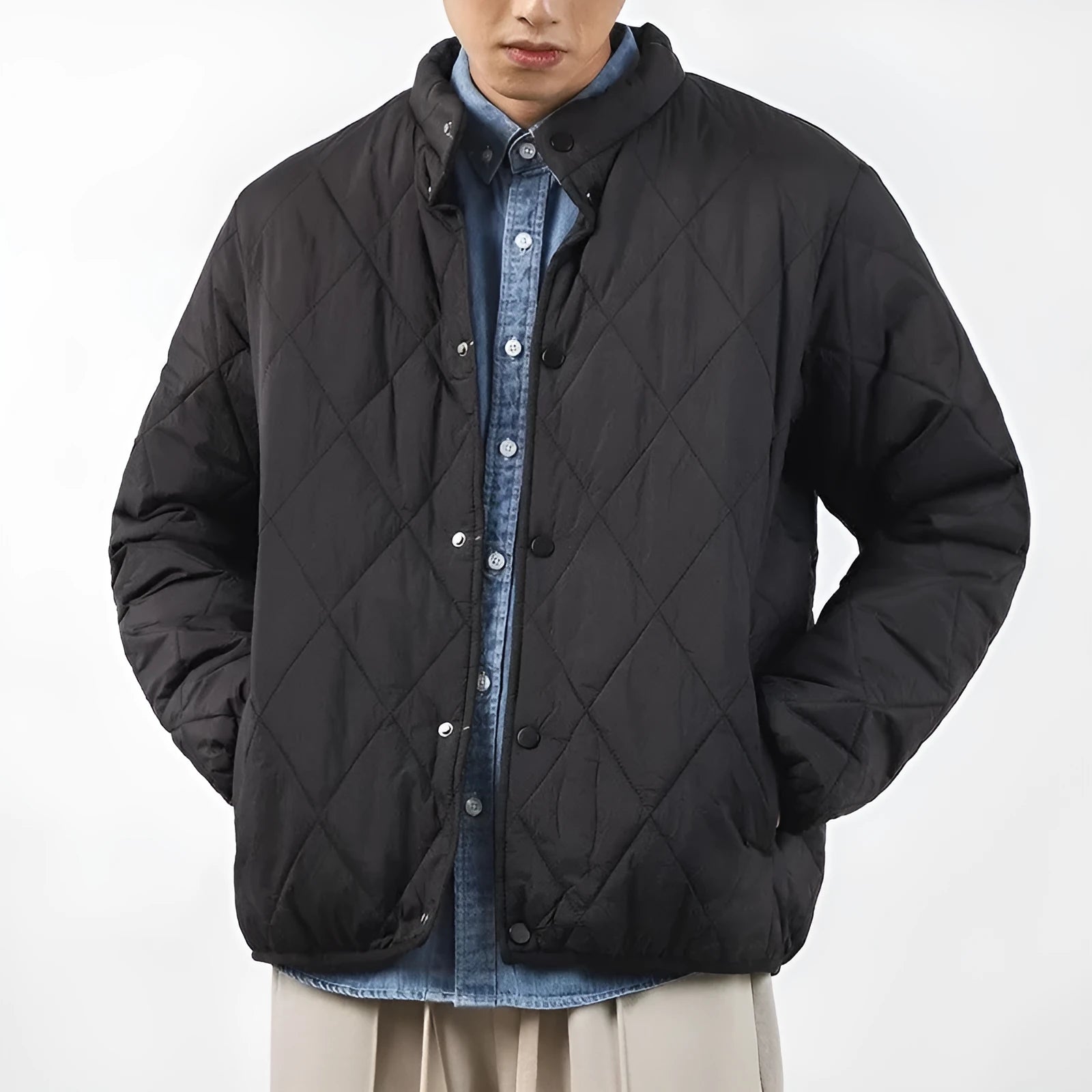 Men's black extended length winter jacket showing loose fit and urban style design