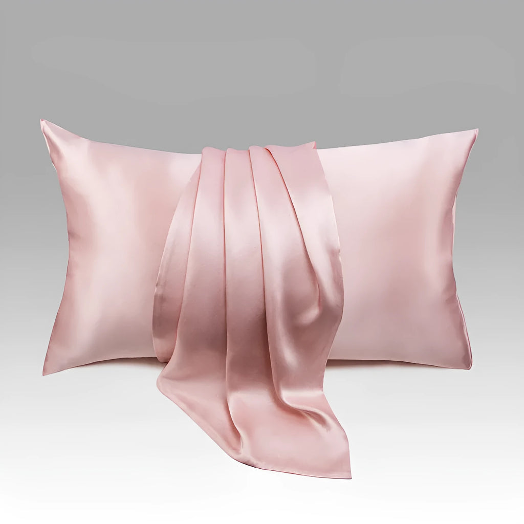 Dark gray envelope closure silk pillowcase on a bed
