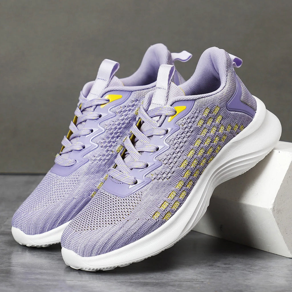 Women's lavender purple Flyknit running shoes with striped pattern and mesh lining