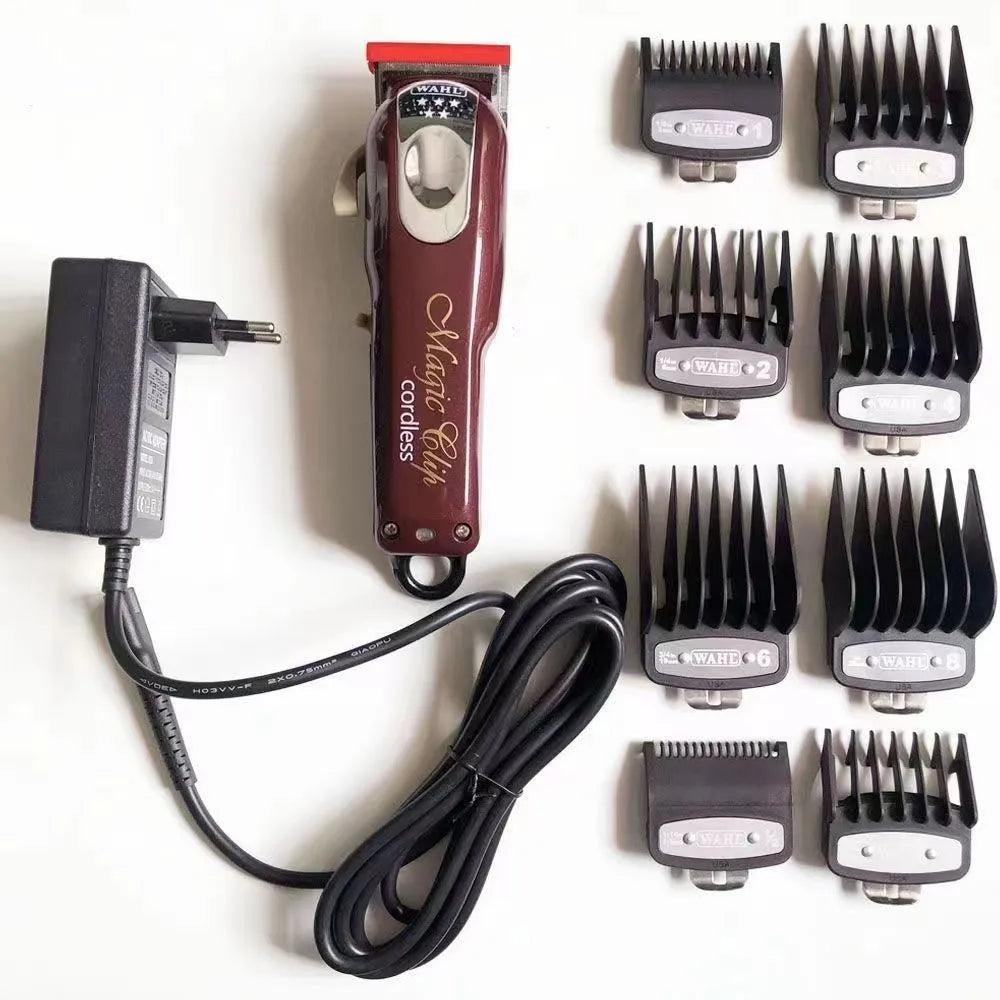 Cordless charging hair clipper set with stainless steel cutter head on a table.