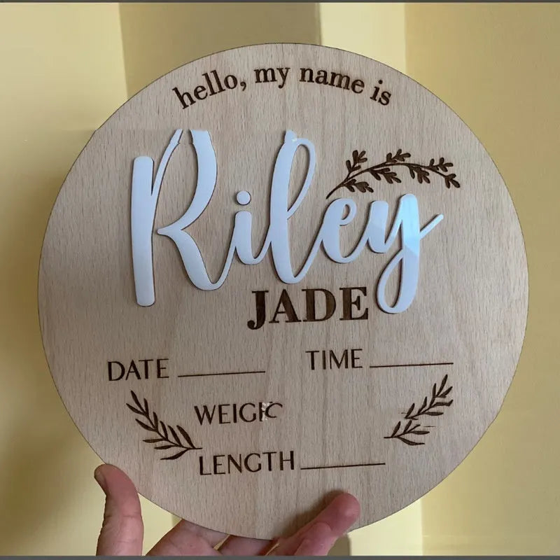 Square wooden baby name plaque showing newborn birth information, 15cm on each side.