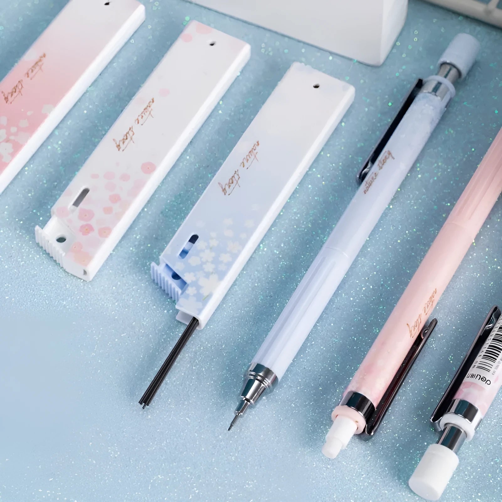 Set of three colourful cartoon-style 0.5mm automatic pencils with boxes of HB refills.