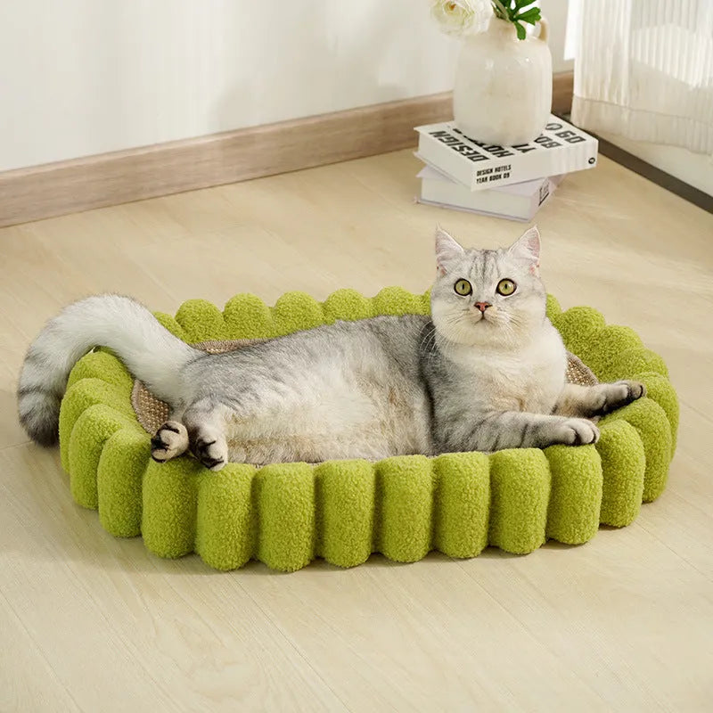 Green oval sisal cat scratcher bed measuring 650mm with scratching surface and lounging area
