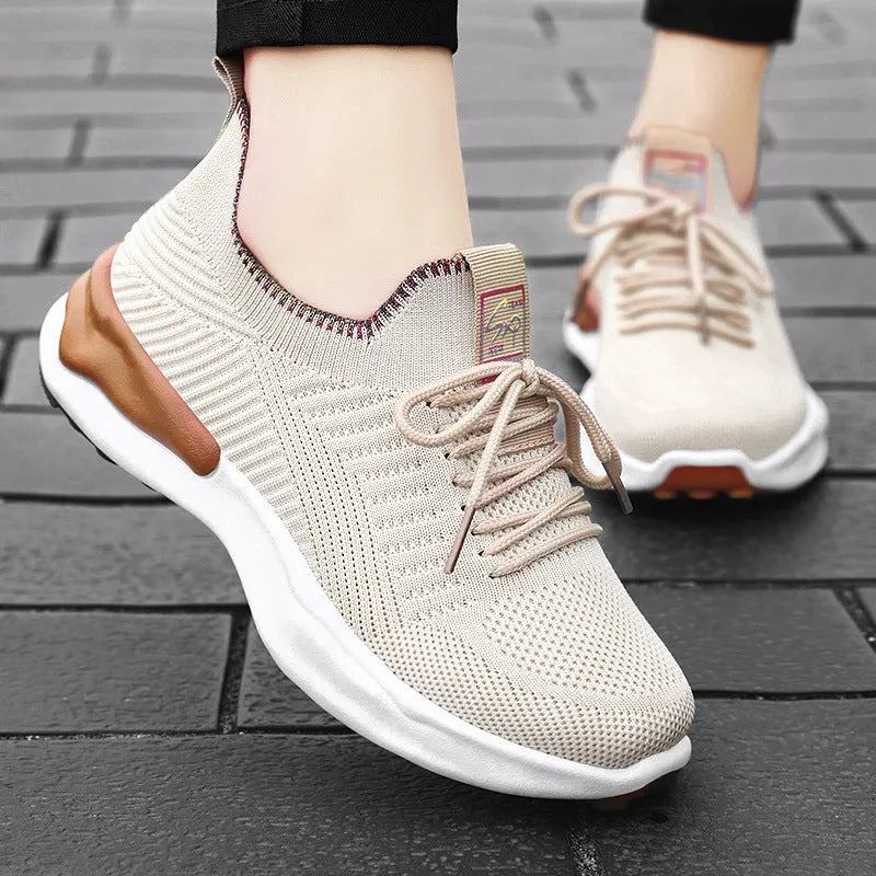 Women's breathable mesh running trainer in white, round toe, flat heel, lace-up