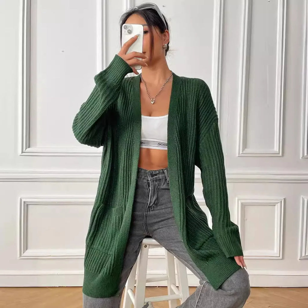 Women's loose acrylic cardigan with two pockets in dark green colour, mid-length design