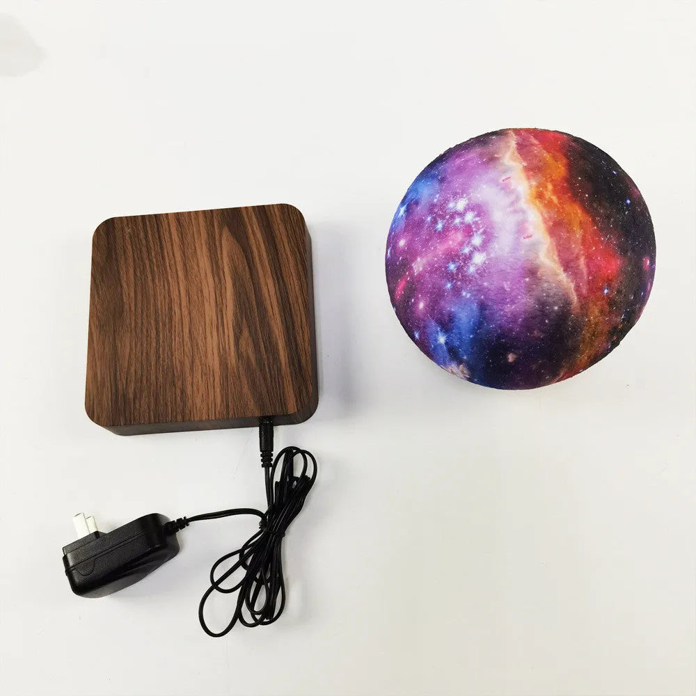 Walnut-coloured magnetic levitation base with a floating, rotating 14cm galaxy moon lamp