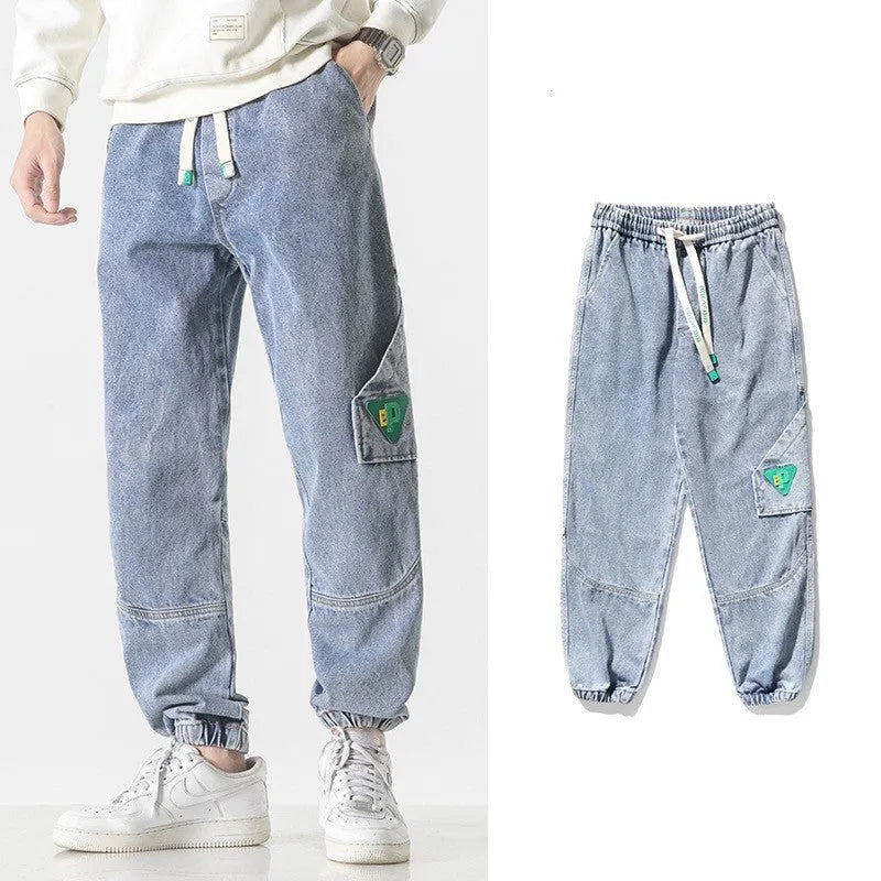 Men's loose-fit tapered cotton trousers in black colour showing mid-waist design and tapered leg cut