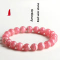 Women's geometric crystal bracelet with natural red patterned stone beads and longevity lock design element