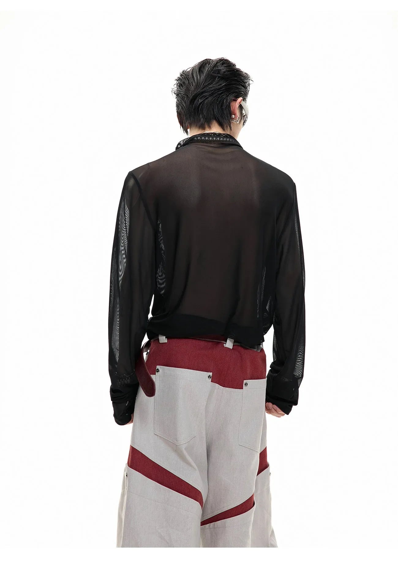 Slim fit black mesh bottoming shirt with long sleeves on a mannequin