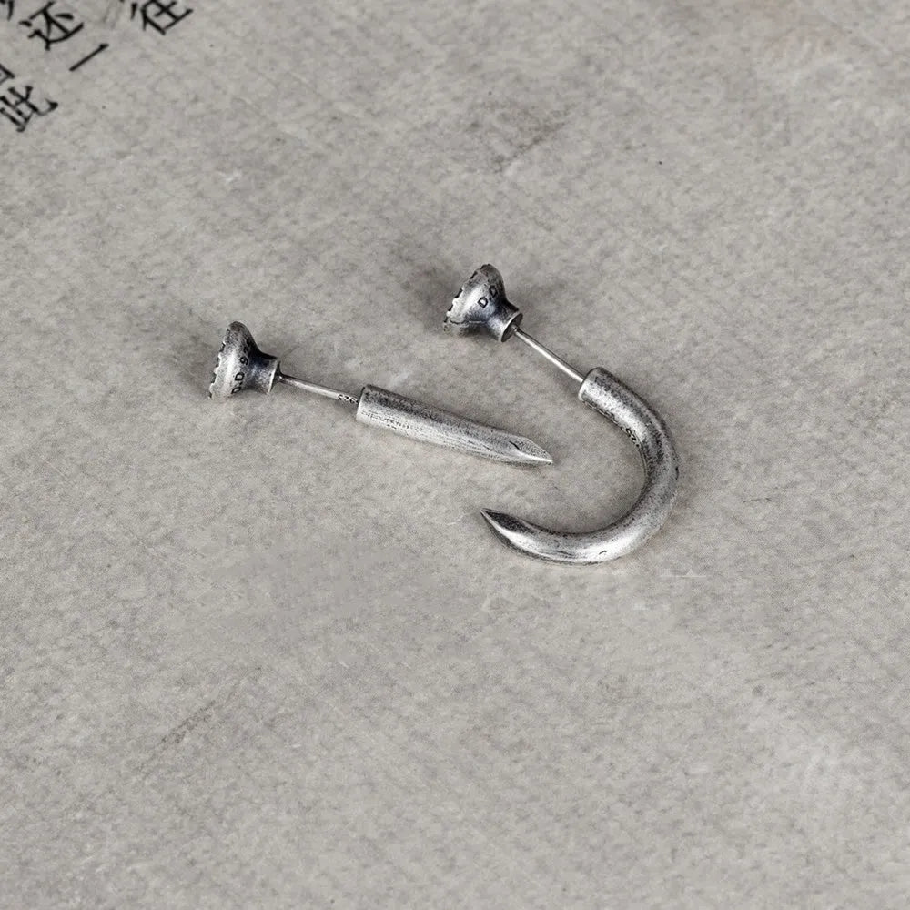 S925 sterling silver nail-shaped stud earring on an ear hook, punk style.