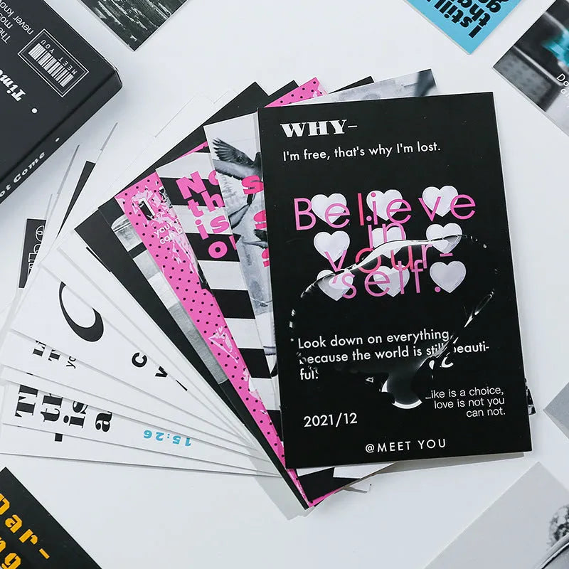 Box containing two designs of simple blessing postcards with messages 'Warm Wind Not Exhausted' and 'Time Not Arrived'.