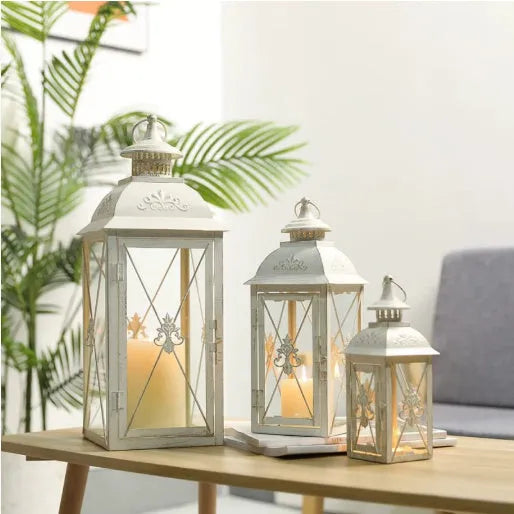 Black and white wrought iron floor-standing storm lantern with tempered glass panels for courtyard use