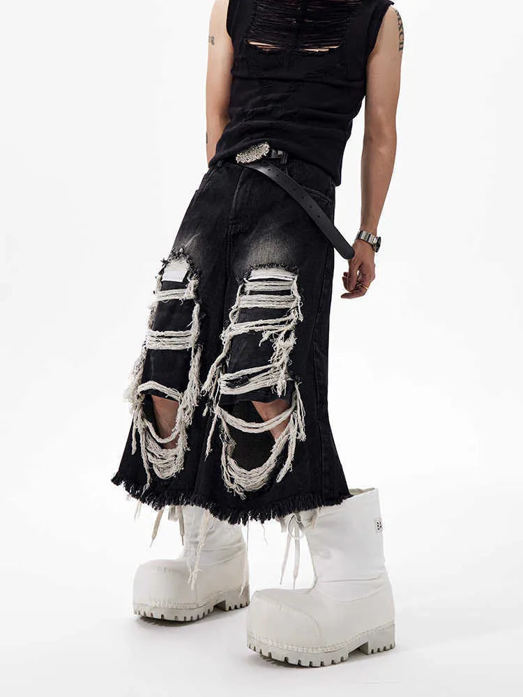 Black women's cropped wide-leg jeans with a mid-high waist and ripped patch distressing.