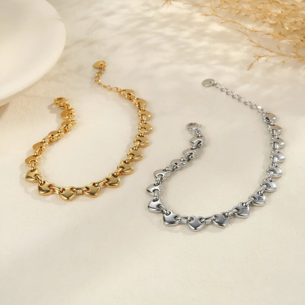 Women's hollowed-out heart bracelet in stainless steel with 18K gold plating on wrist