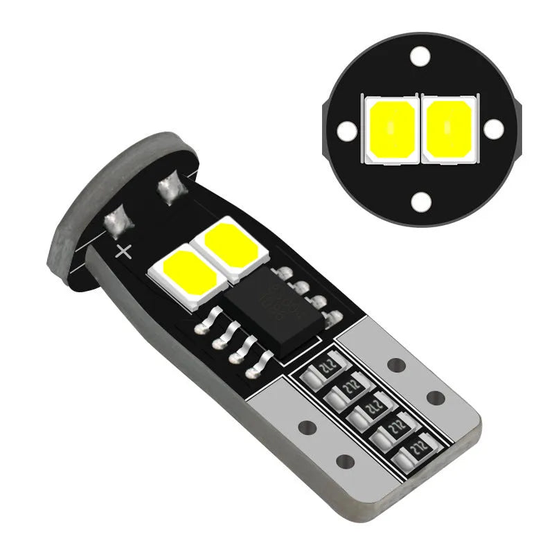 Small white automotive replacement bulb for car licence plate light, 10mm size.