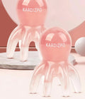 Pink natural resin octopus-shaped massage comb for periocular meridian relief with storage bag.