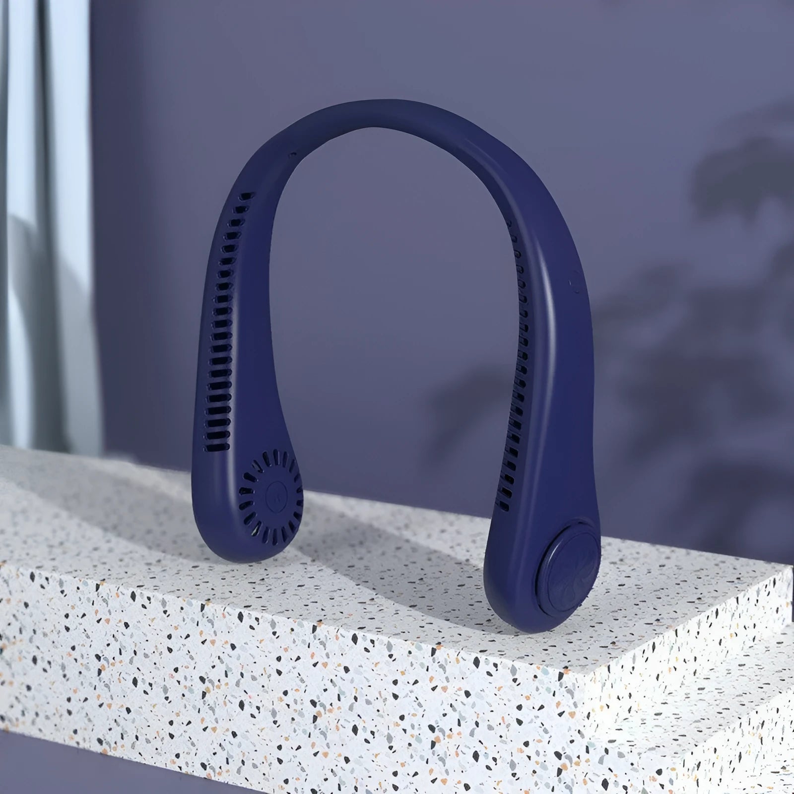 Blue bladeless neck fan with USB charging cable, worn around neck.